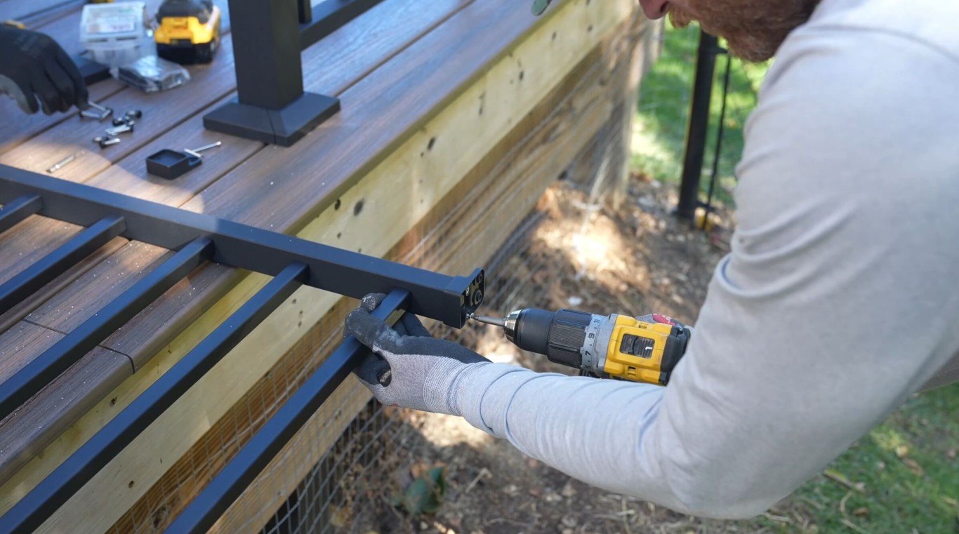 Professional deck construction worker installing deck in Santa Maria, CA